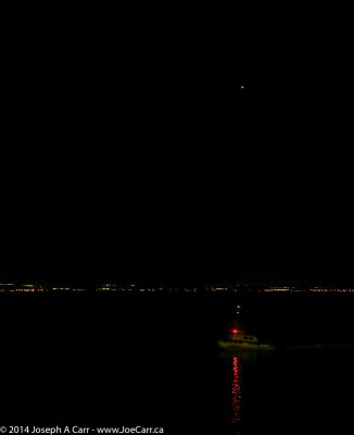 Venus rising in the east before sunrise with the pilot boat beside us, as we approach San Diego