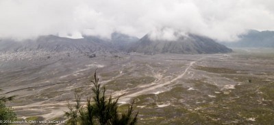Cloud-shrouded Mount Bromo and the Sea of Sand, Cemoro Lawing, Java, Indonesia