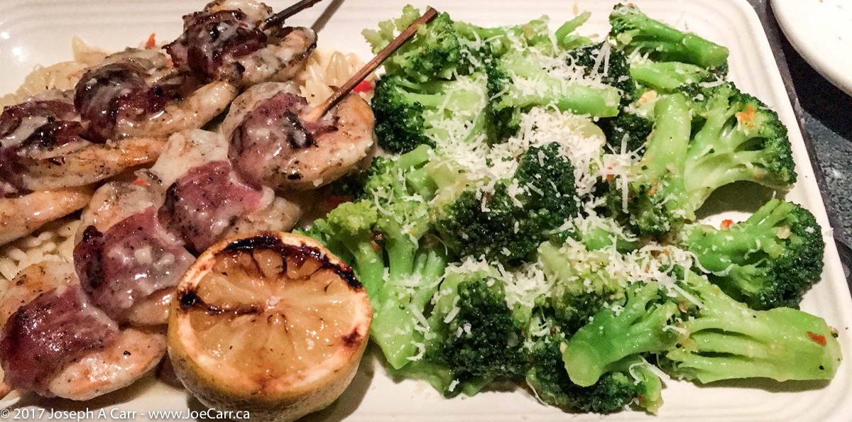Proscuitto-wrapped shrimp with broccoli