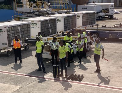 Airport ground crew waiting for clearance to unload the aircraft WestJet at Montego Bay