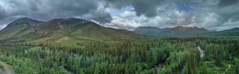 Panorama of the valley and Oglivie Mountains with two hanging valleys on the left - South Dempster Highway